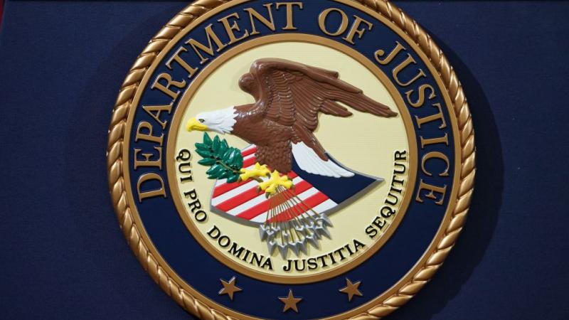 DOJ seal on lectern in 2018
