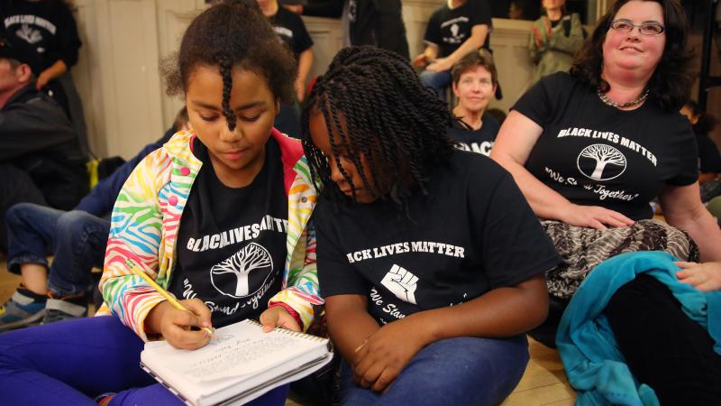 Teachers and students wear "Black Lives Matter" shirts in school