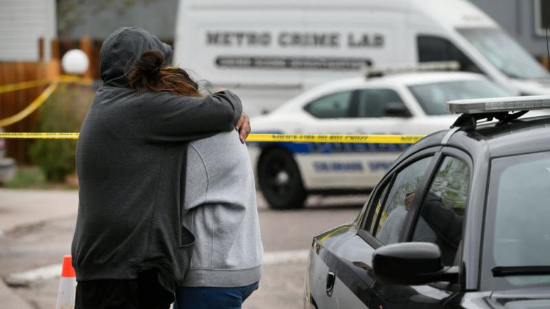  Freddy Marquez, left, hugs his wife Nubia whose mother was one of six shooting victims at the Colorado Springs shooting early Sunday morning.
