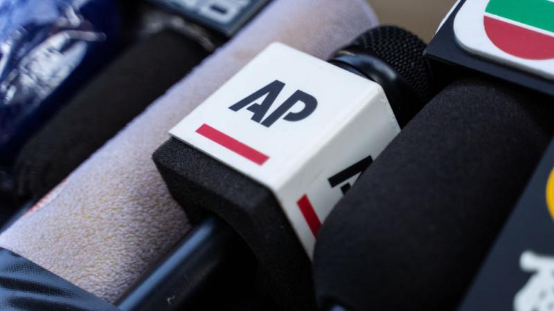 Associated Press logo on a microphone. 
