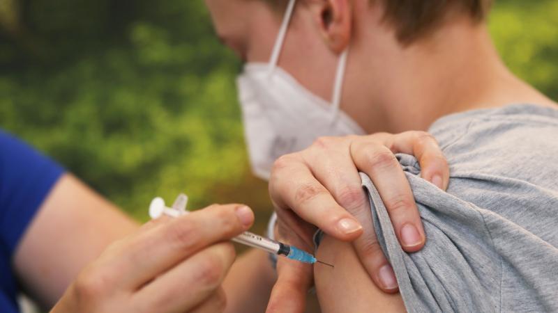 Child receiving COVID vaccine