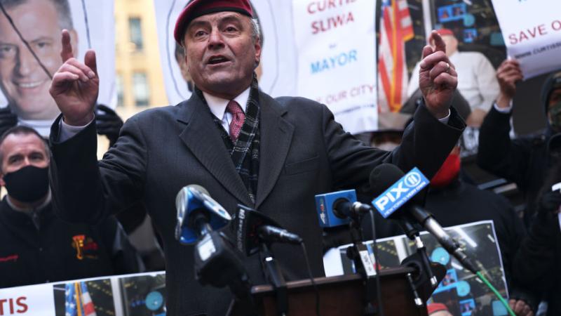 Curtis Sliwa at a press conference.