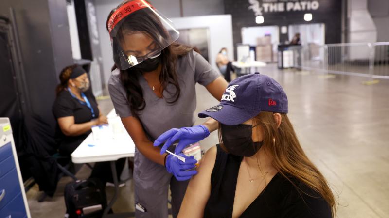 Viannca Barcema gets a COVID-19 vaccine from Joyce Kamhiriri at Guaranteed Rate Field before the start of the Chicago White Sox game against the Toronto Blue Jays on June 08, 2021 in Chicago, Illinois.