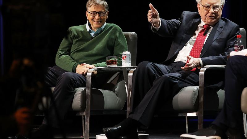 Bill Gates and Warren Buffett speak at a 2017 Columbia Business School event.