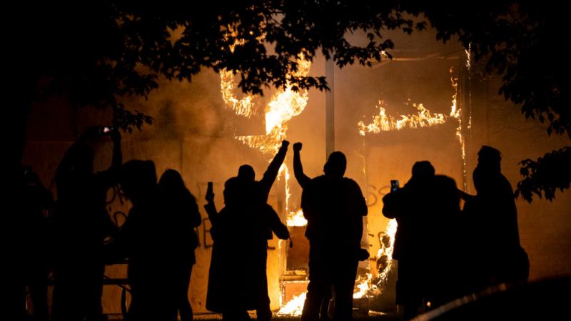 Protesters cheer during riot after George Floyd death.