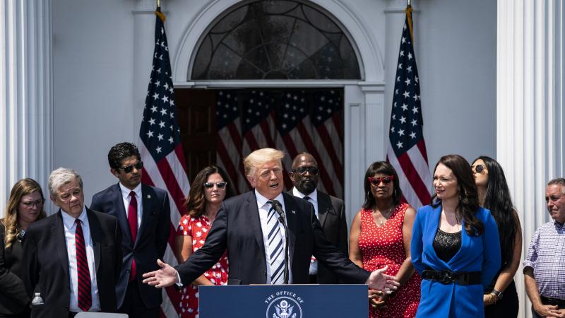 Former President Donald J. Trump and Brooke Rollins president and CEO of the America First Policy Institute, speak about filing a class-action lawsuits targeting Facebook, Google and Twitter and their CEOs, escalating his long-running battle with the companies following their suspensions of his accounts, during a press conference at the Trump National Golf Club on Wednesday, July 07, 2021 in Bedminster, NJ.