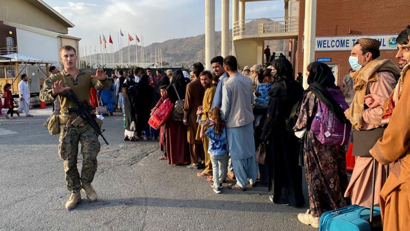Afghans line up to leave the country from Kabul
