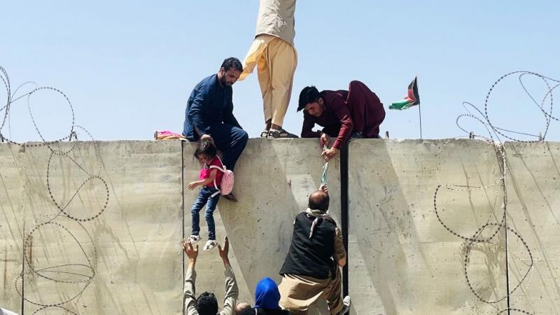 Afghans attempting to flee the country