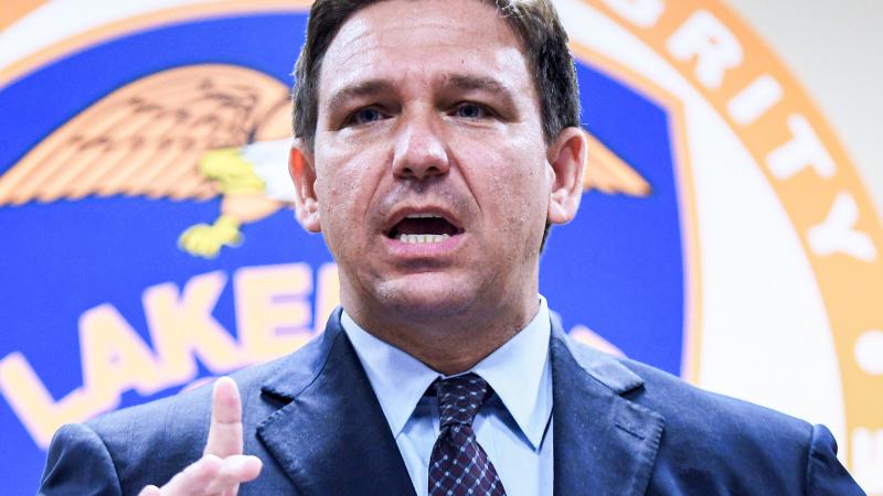 Florida Governor Ron DeSantis speaks at a press conference at the Lakeland, Florida Police Department to announce a new proposal that would provide $5,000 signing bonuses to those who sign on to be law enforcement officers from within the state of Florida, and those who come from out-of-state.