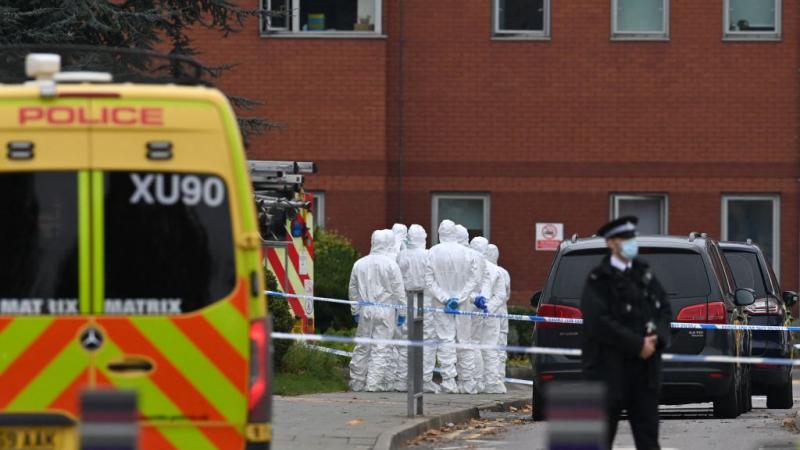 Police forensics officers work outside the Women's Hospital in Liverpool