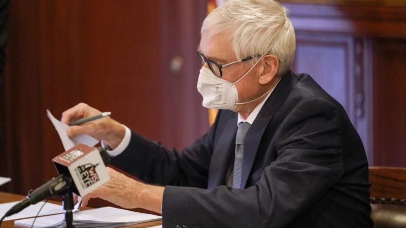 Wisconsin Gov. Tony Evers, a member of Wisconsin's Electoral College, casts his vote for the presidential election at the state Capitol on December 14, 2020 in Madison, Wisconsin