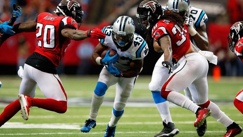 Phillip Adams #20 and Charles Godfrey #30 of the Atlanta Falcons during the first half at the Georgia Dome on December 27, 2015 in Atlanta, Georgia