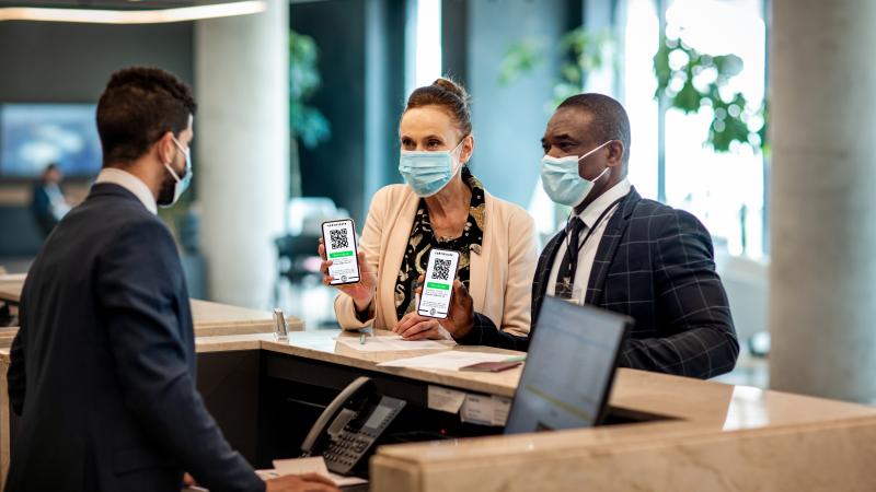 Man, woman show vaccine passport at hotel