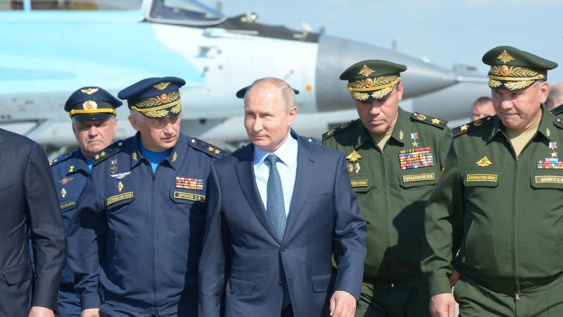 Vladimir Putin with top military officials, Akhtubinsk, Russia, May 14, 2019