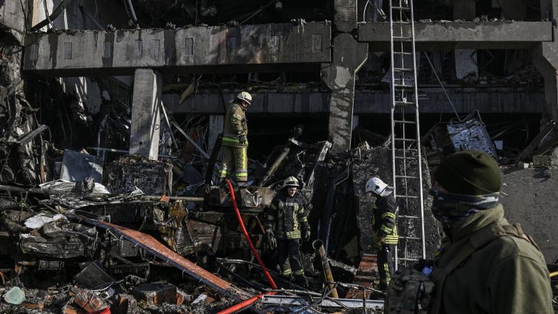 Firefighters at destroyed building, Kyiv, Ukraine, March 21, 2022