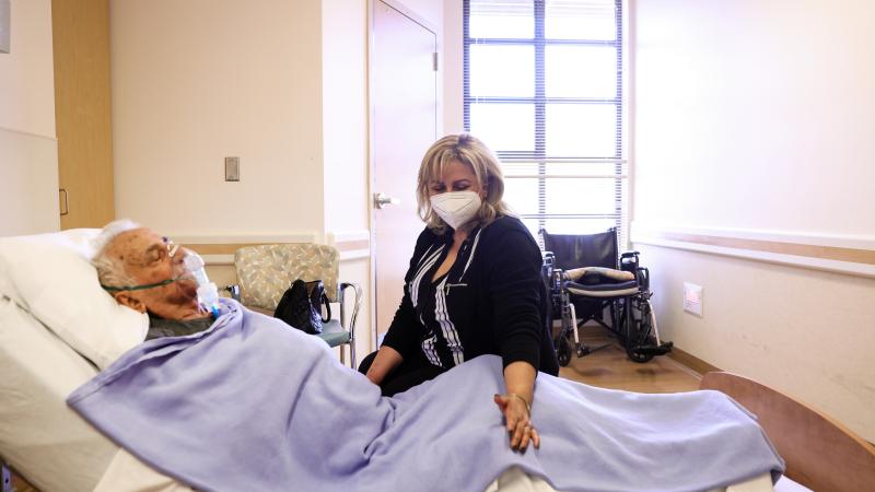 Resident Hanna Nasi is visited by daughter Surab Nasrallah on the first day of in-room family member visits at the Ararat Nursing Facility in the Mission Hills neighborhood on March 24, 2021 in Los Angeles, California.
