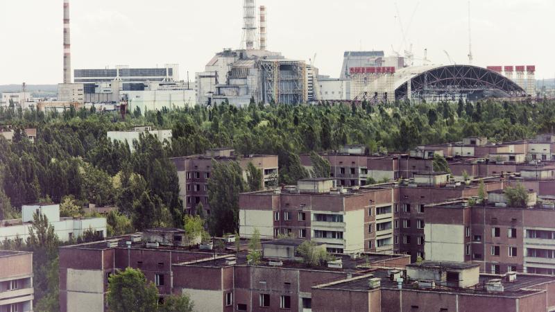The Chernobyl nuclear plant towers over the ghost town of Pripyat
