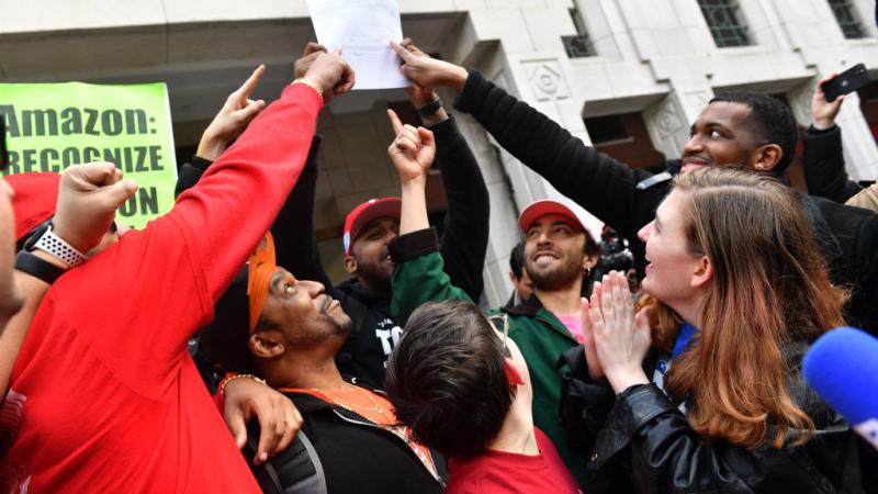 Amazon workers celebrate the successful union vote on Staten Island, Apr. 1