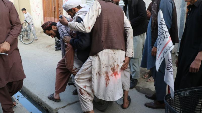 Wounded people are dispatched to hospitals after a bomb exploded in a mosque in the Afghan capital Kabul during Friday prayers on April 29, 2022