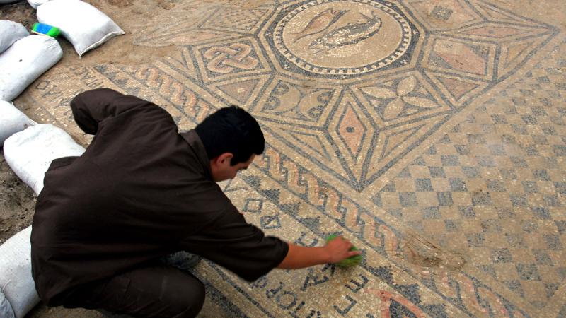 Prisoner cleans early Christian mosaic, Megiddo prison, Nov. 6, 2006