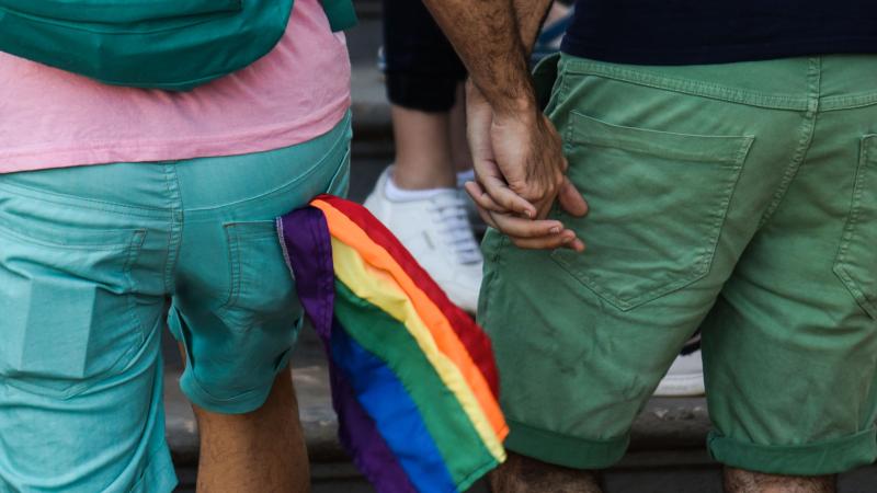 LGBT couple holds hands, Uruguay, Sept. 29, 2018