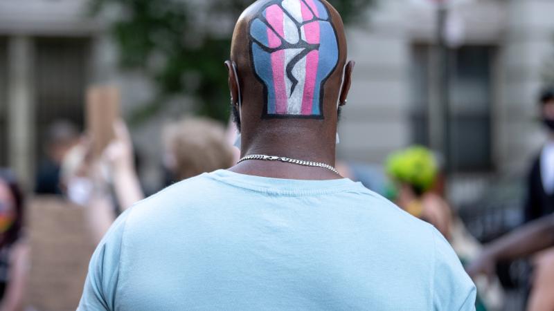 Black Lives Matter protester with transgender fist, New York City, June 16, 2020
