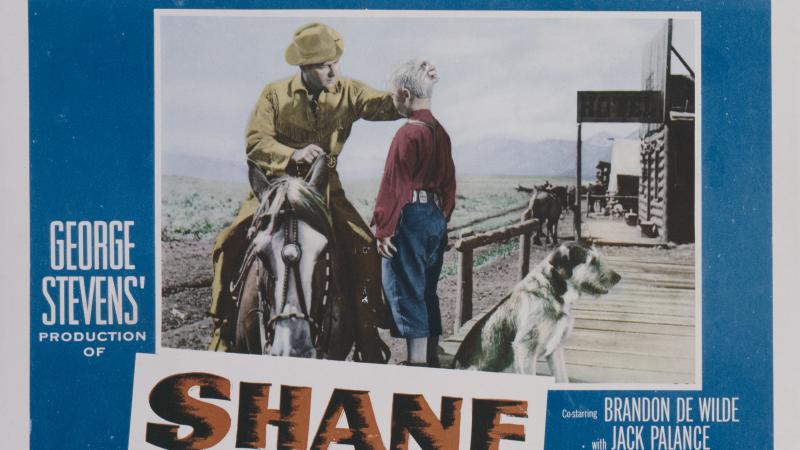 Actors Alan Ladd (left) and Brandon De Wilde appear on a poster for the Paramount Pictures western 'Shane', 1953.