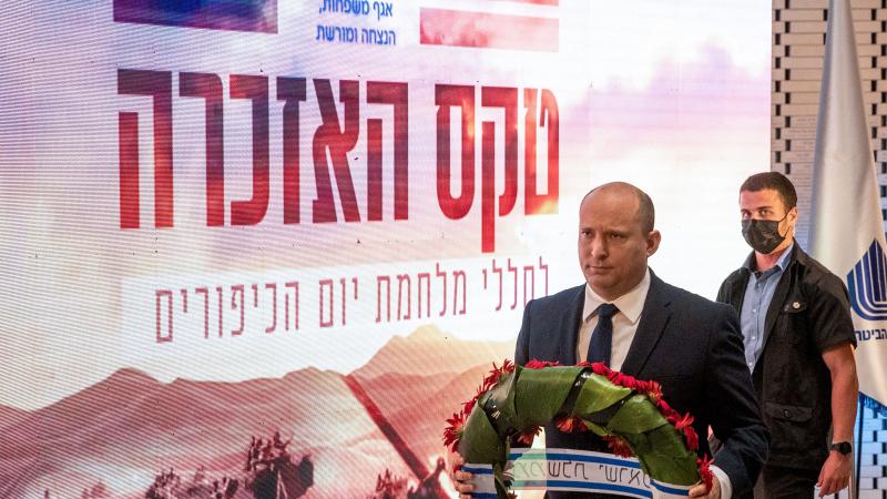 Israeli Prime Minister Naftali Bennett prepares to lay a wreath during the memorial ceremony for the fallen soldiers of the 1973 Yom Kippur War, at the Hall of Remembrance on Mt. Herzl in Jerusalem on September 19, 2021.