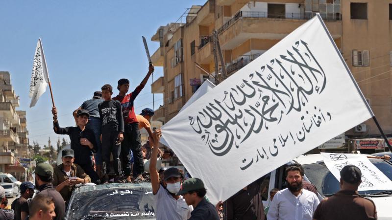Islamic Emirate of Afghanistan flags, Idlib, Syria, Aug. 20, 2022