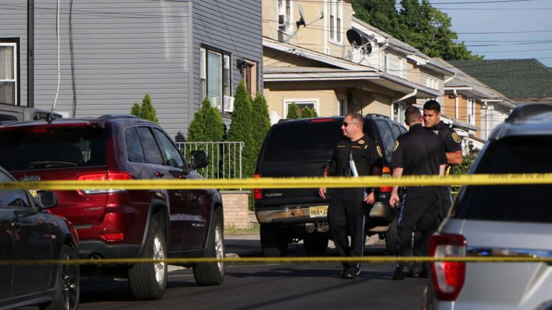 Police outside the house of Rushdie's alleged attacker, Aug. 13