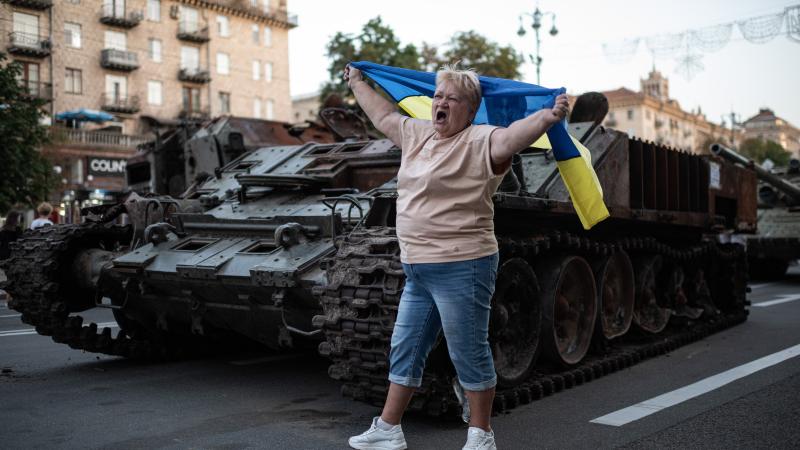 Woman celebrates, Kyiv, Ukraine, Aug. 24, 2022