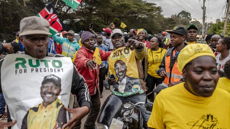 Supporters of Kenyan President elect William Ruto celebrate while gathering at the entrance of Ruto's residence as he addresses the media in Nairobi, Kenya, on September 5, 2022