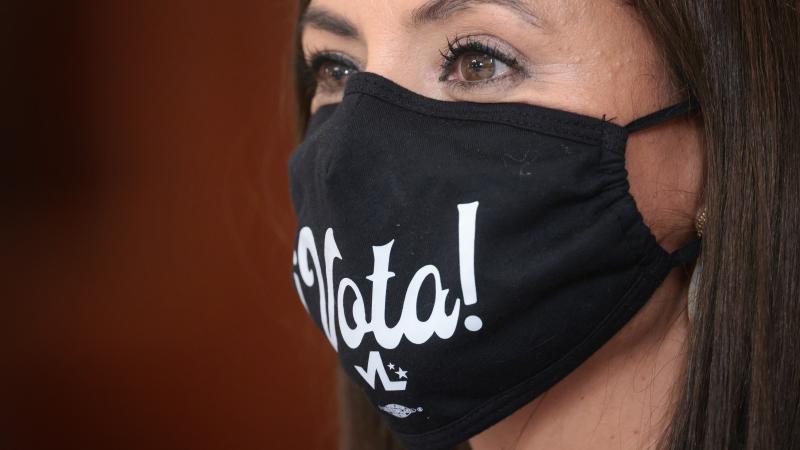 A guest listens as U.S. President Joe Biden speaks during a meeting with Latino community leaders in the State Dining Room of the White House August 3, 2021 in Washington, DC.