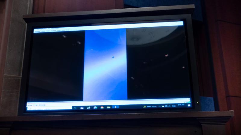A frame of an unidentified aerial phenomenon at a House Intelligence Committee hearing, May 2022