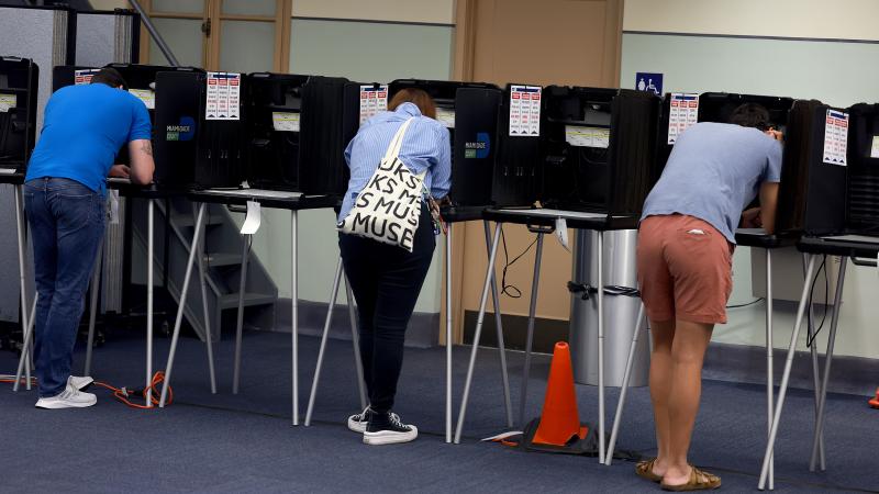 Voters cast their ballots at a polling station on November 08, 2022 in Miami, Florida