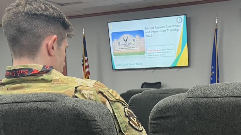 Service member wearing Bad Dragon lanyard during sexual harassment training