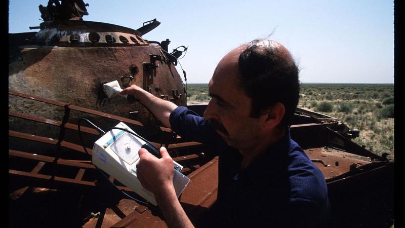 A worker checks a tank for radiation levels amid usage of the 'Silver Bullet,' 1998