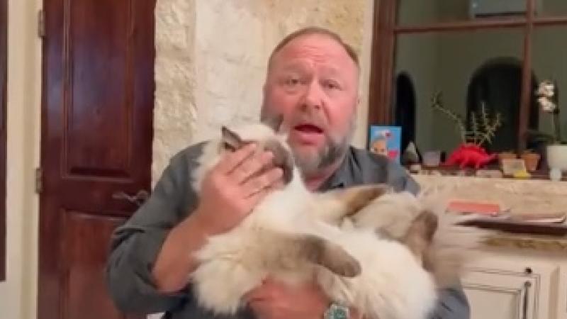 Alex Jones and his cat, Mooshu