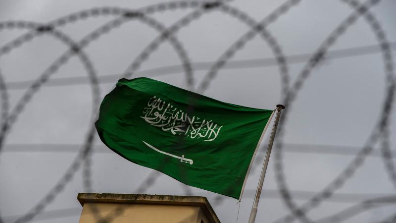 Saudi Arabia flag, barbed wire, Istanbul, Turkey, Oct. 13, 2018