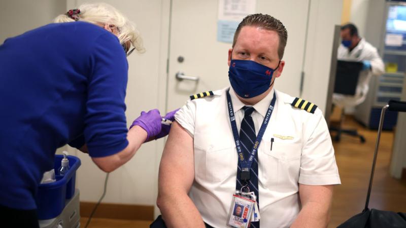 United Airlines pilot receives COVID-19 vaccine
