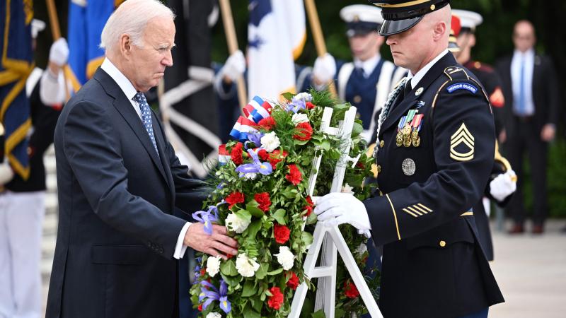 US President Joe Biden participates in a wreath-laying ceremony at the Tomb of the Unknown Soldier in Arlington National Cemetery in Arlington, Virginia, on May 29, 2023, in observance of Memorial Day