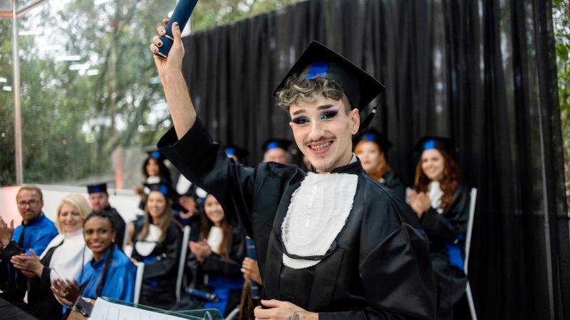 Nonbinary college graduate, file photo