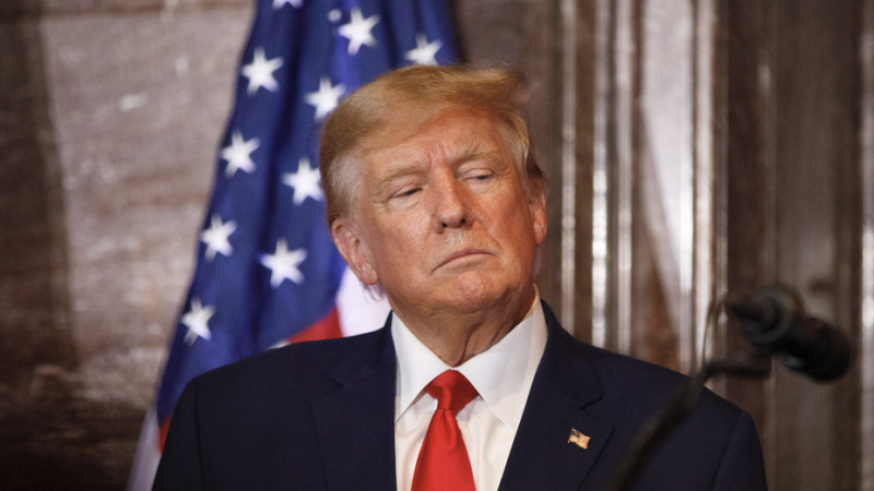 Trump solemnly looks left