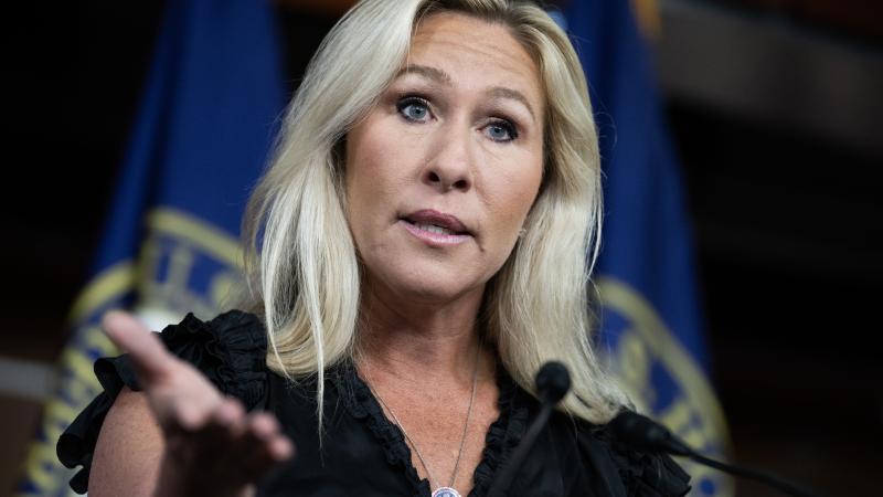 Rep. Marjorie Taylor Greene, R-Ga., conducts a news conference in the Capitol Visitor Center on her plans to file articles of impeachment against President Biden on Thursday, May 18, 2023.