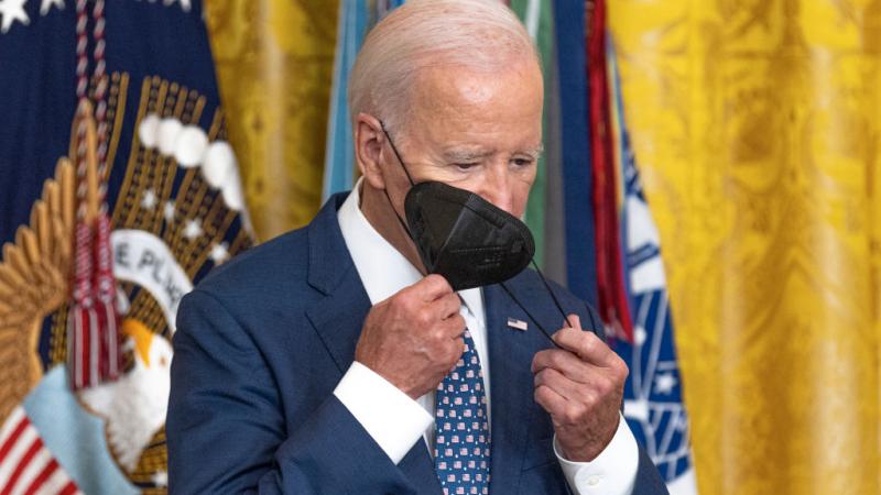 Joe Biden wears a mask