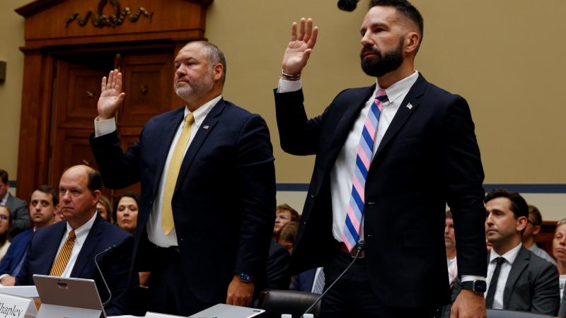 IRS Agents and whistleblowers Gary Shapley, left and Joseph Ziegler, are sworn in during Congress at a House Oversight and Accountability Committee hearing, Wednesday, July 19, 2023, in Washington DC (The Washington Post).