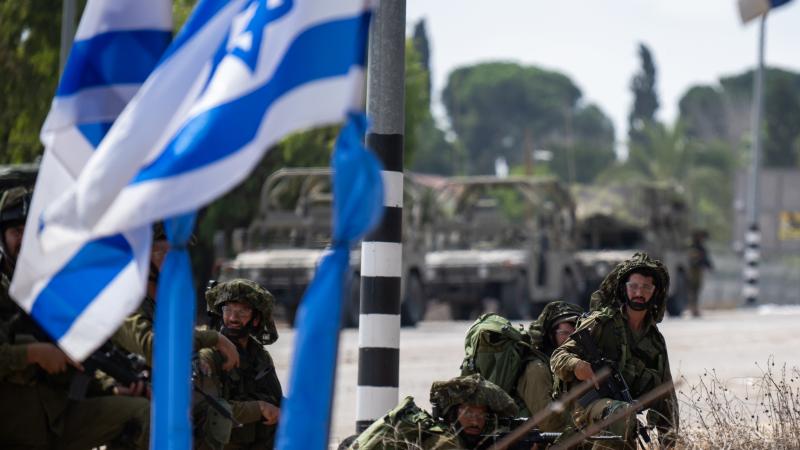 IDF, flag, Kfar Aza, Israel, Oct. 10, 2023