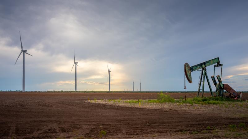 Oil pumpjack, wind turbine, Oct. 04, 2023, Nolan, Texas