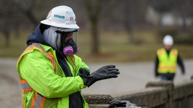 Contractors are cleaning up and testing Sulphur Run, a creek that runs from the derailment site through the center of East Palestine, Ohio. 
