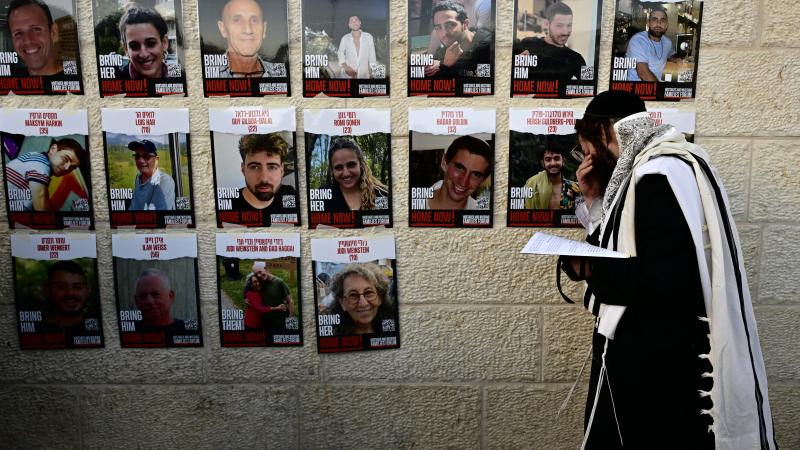 Hostage/kidnapped posters, Jewish man, Jerusalem, Jan. 10, 2024
